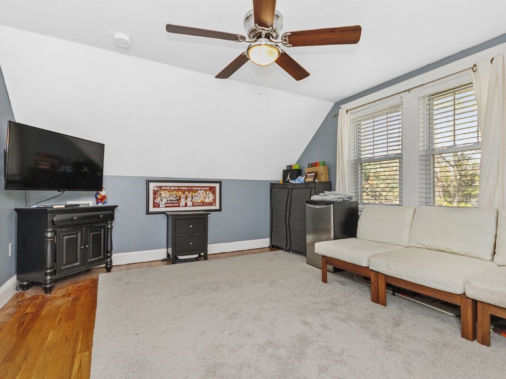 435 Old Post Road Walpole, MA 02081 - Photo 24 of 36 a living room with furniture and a flat screen tv
