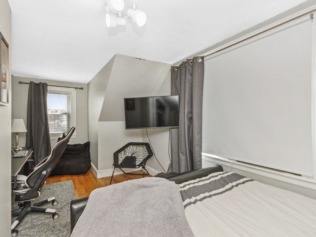 435 Old Post Road Walpole, MA 02081 - Photo 26 of 36 a bedroom with a bed and a flat tv screen on the dresser