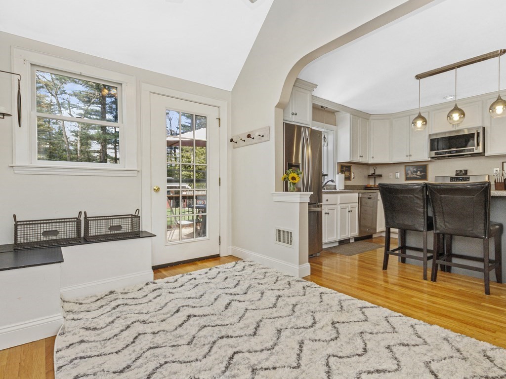 435 Old Post Road Walpole, MA 02081 - Photo 8 of 36 a kitchen with stainless steel appliances kitchen island granite countertop a refrigerator cabinets and wooden floor