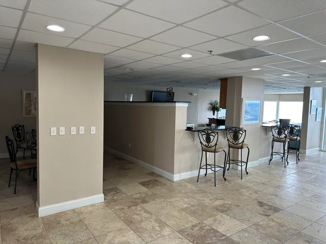 a view of a living room and kitchen