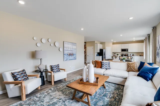 a living room with furniture and a table