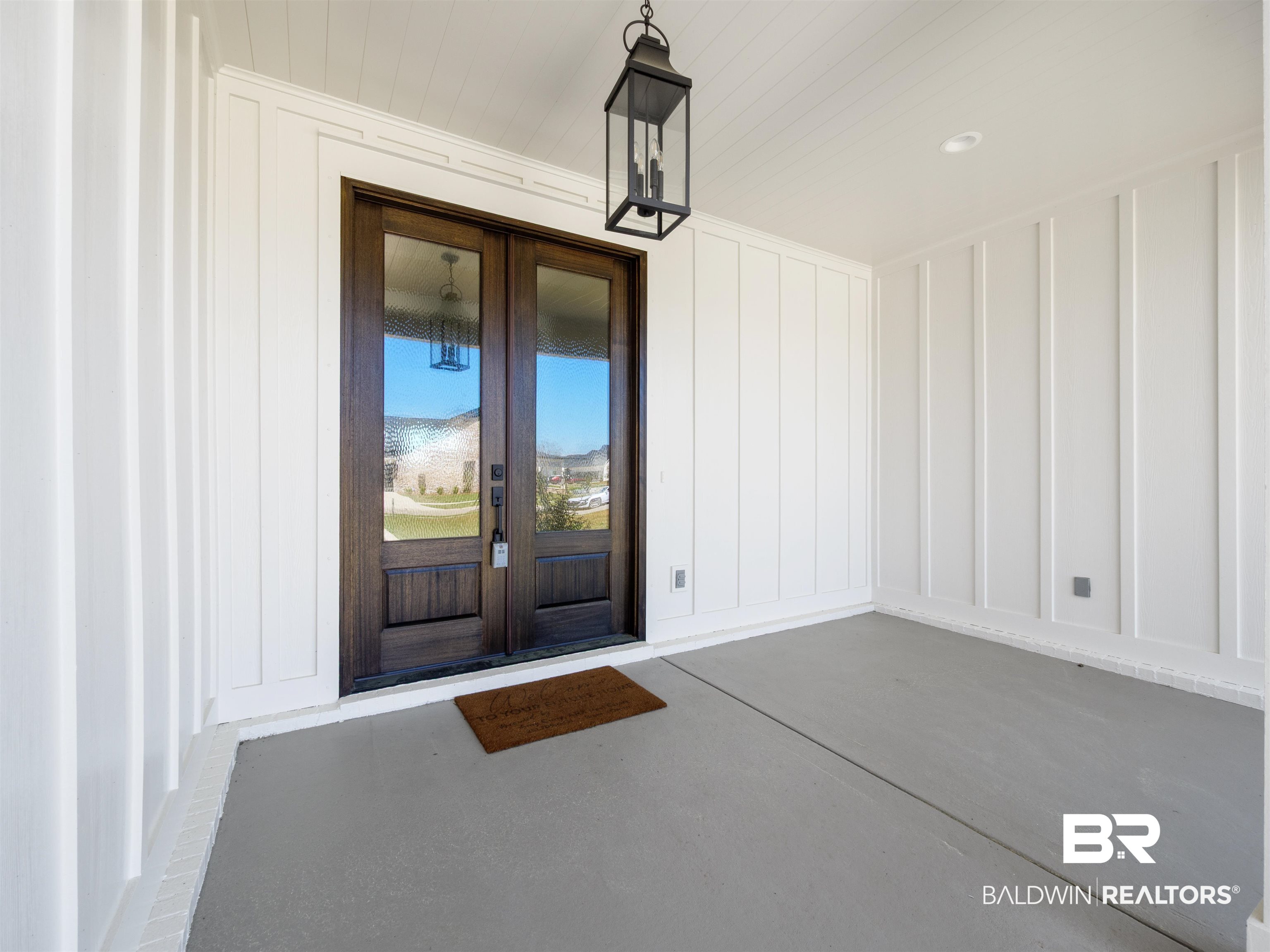 10970 Turin Avenue Fairhope, AL 36532 - Photo 2 of 61 Front porch has painted floors and painted tongue & groove ceilings an French front doors