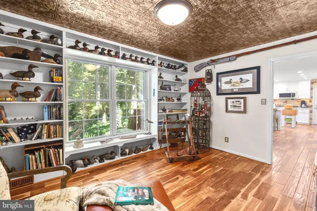 a bathroom with a sink mirror and toilet