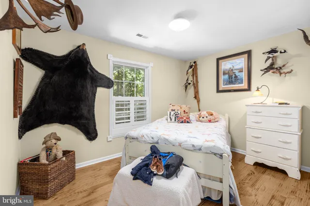 a room with furniture and musical instruments