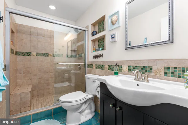 a view of a hallway with a door and stairs