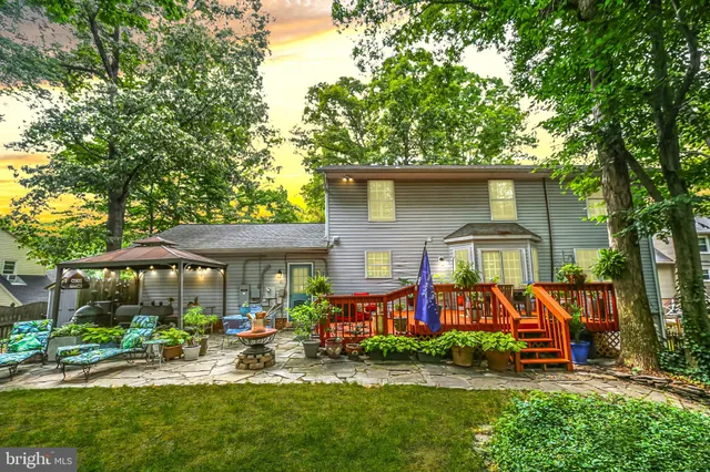 a view of a patio with furniture and wooden floor