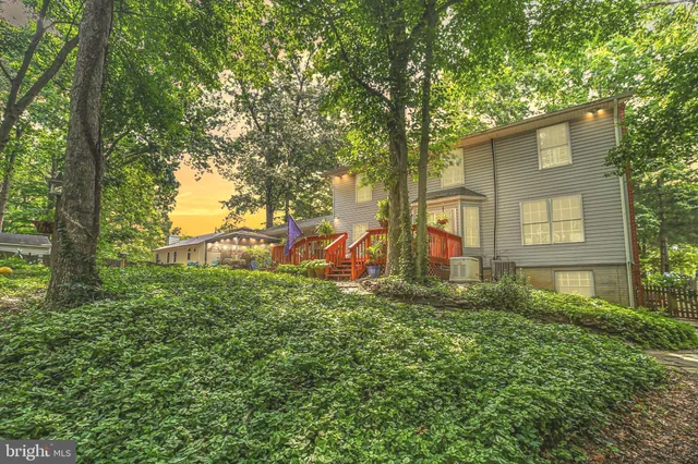 a balcony with furniture and potted plants