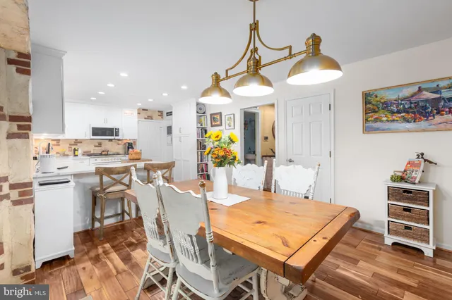 a bedroom with furniture and a large window