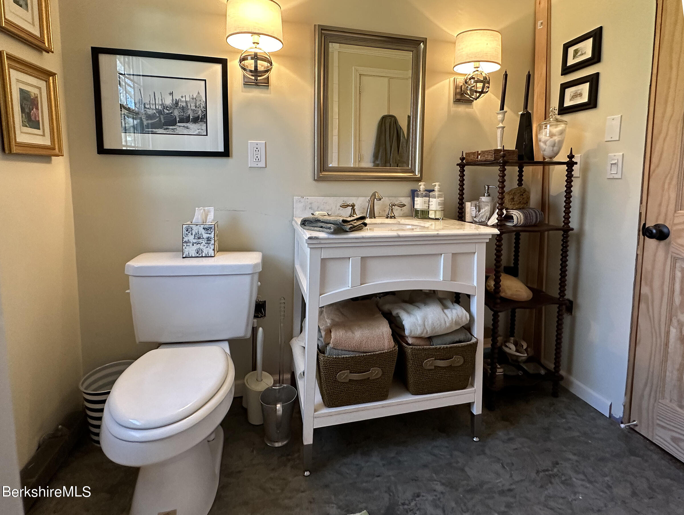 224 County Rte 7A Copake, NY 12516 - Photo 11 of 14 a bathroom with a toilet a sink and a mirror