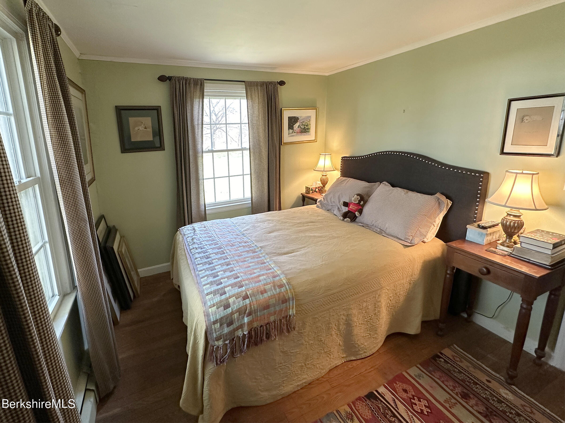 224 County Rte 7A Copake, NY 12516 - Photo 12 of 14 a bedroom with a bed and wooden floor