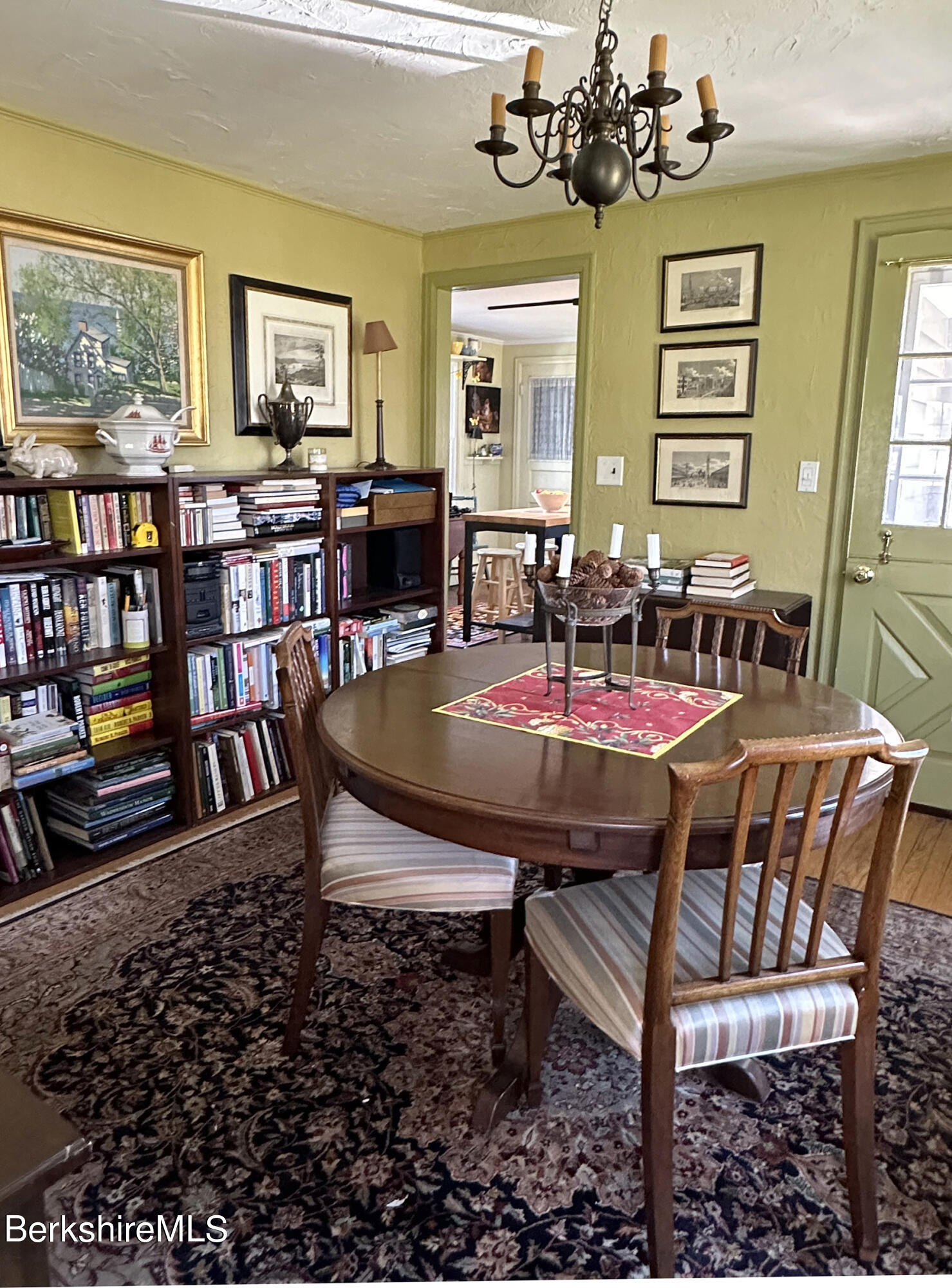 224 County Rte 7A Copake, NY 12516 - Photo 5 of 14 a view of a dining room with furniture and a bookshelf