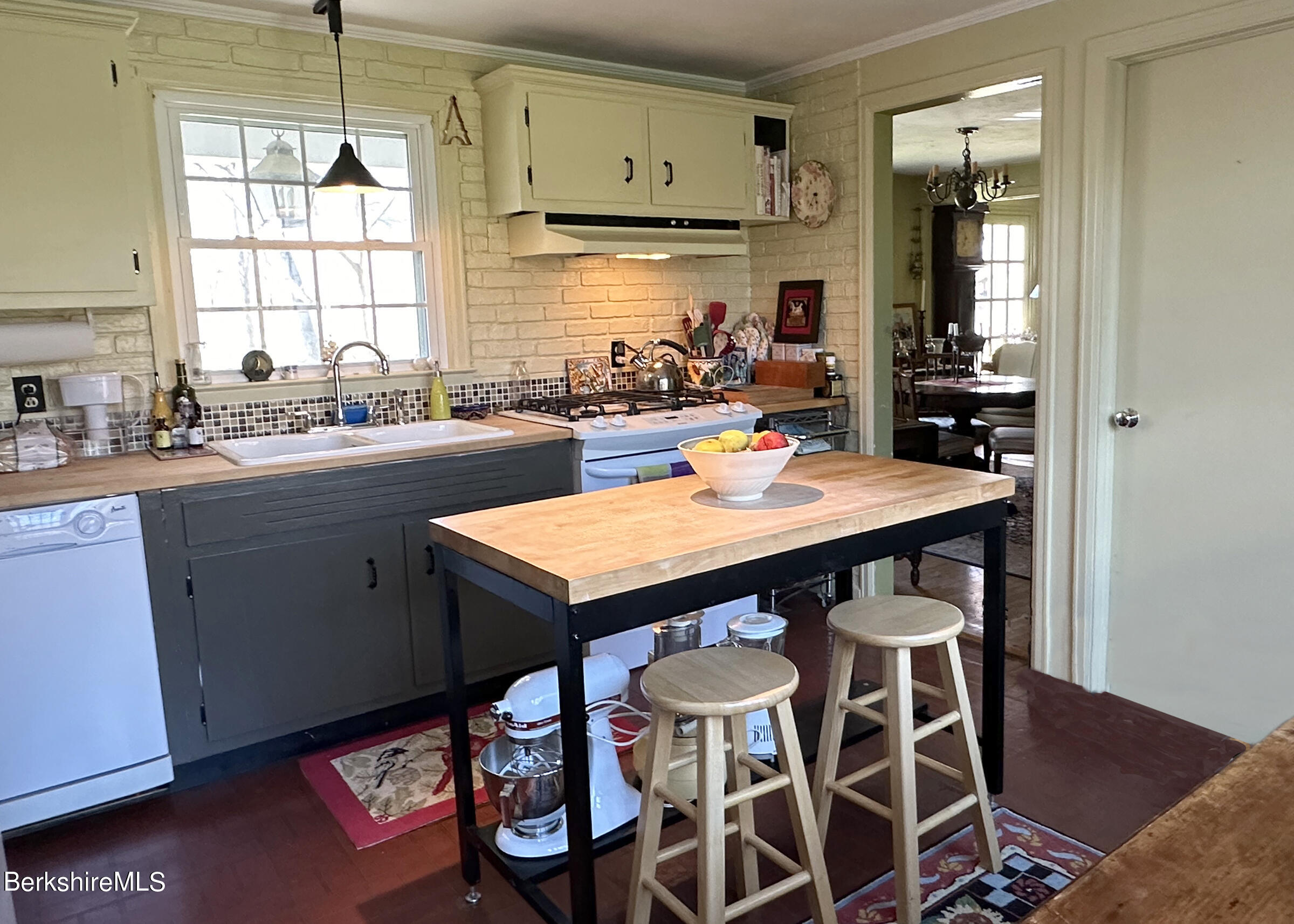 224 County Rte 7A Copake, NY 12516 - Photo 8 of 14 a kitchen with a sink stove and cabinets