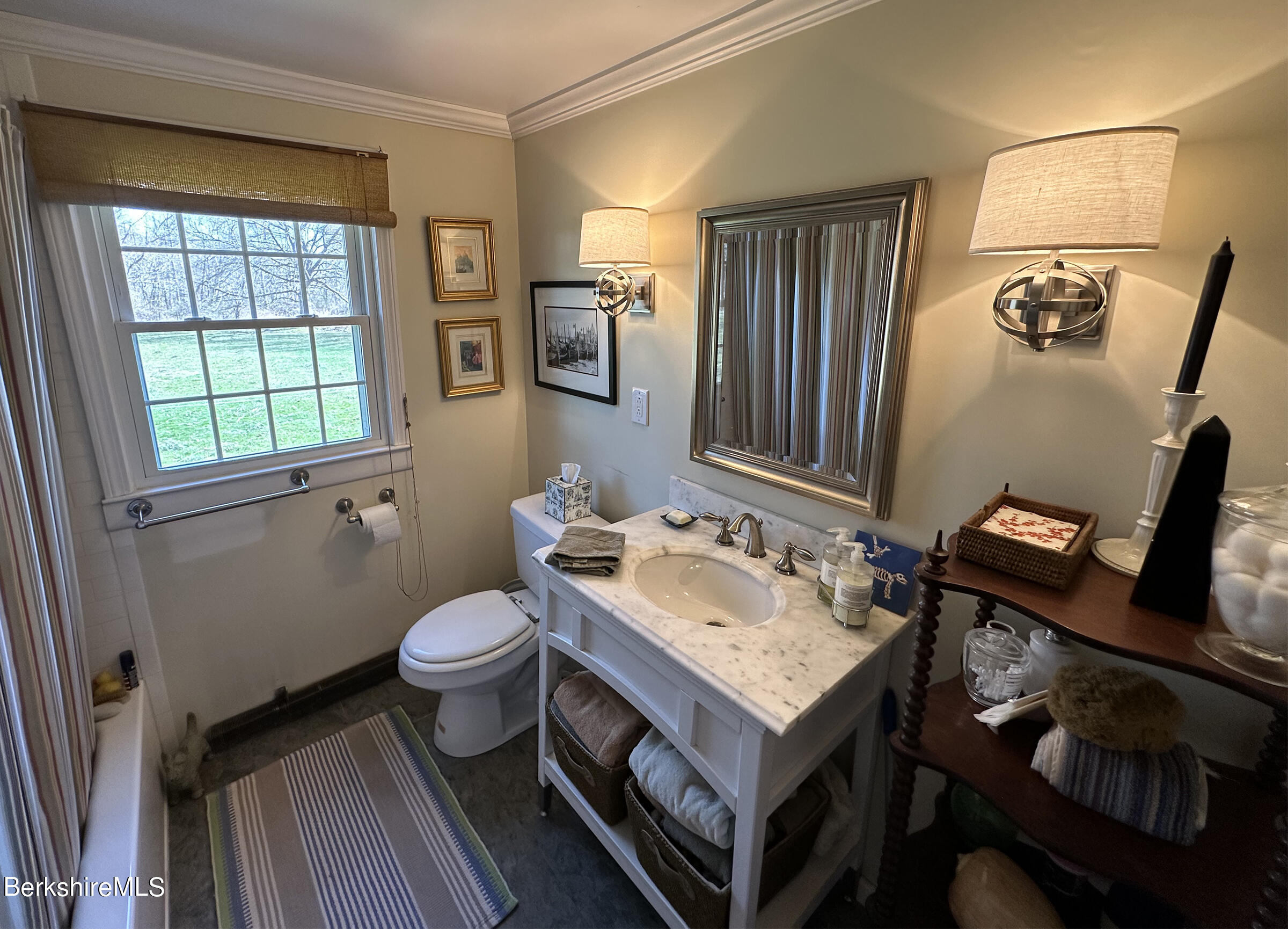 224 County Rte 7A Copake, NY 12516 - Photo 10 of 14 a bathroom with a sink toilet and mirror