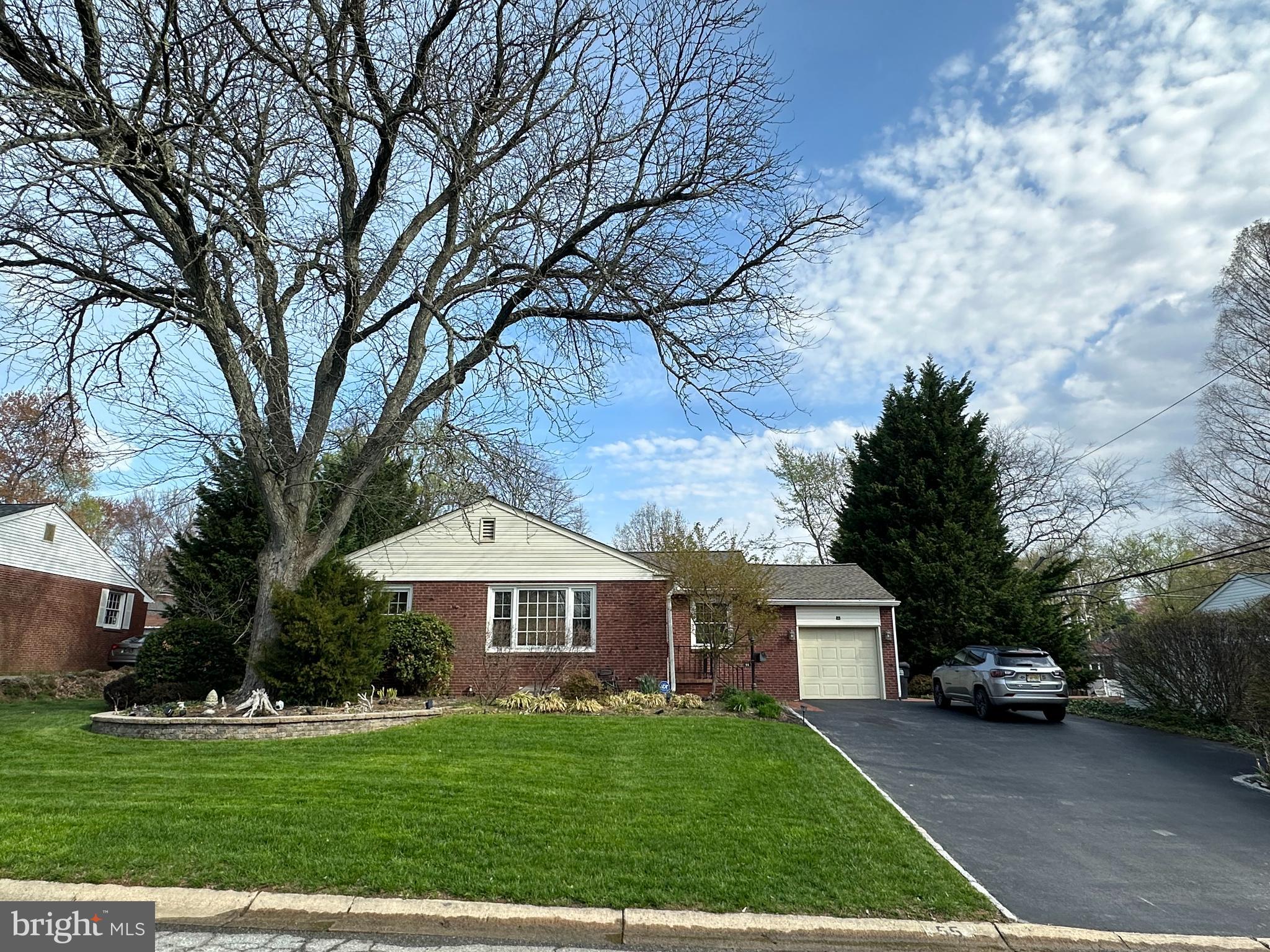 55 Paschall Road Wilmington, DE 19803 - Photo 1 of 18 a front view of a house with a garden