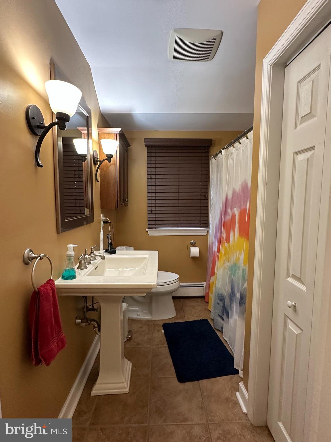 55 Paschall Road Wilmington, DE 19803 - Photo 15 of 18 a bathroom with a sink and a mirror