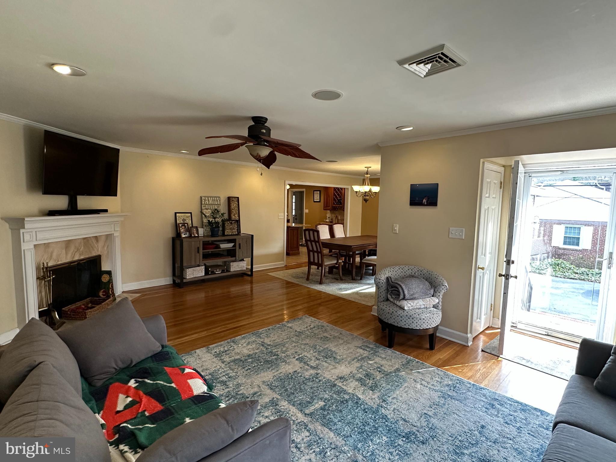 55 Paschall Road Wilmington, DE 19803 - Photo 2 of 18 a living room with fireplace furniture and a flat screen tv
