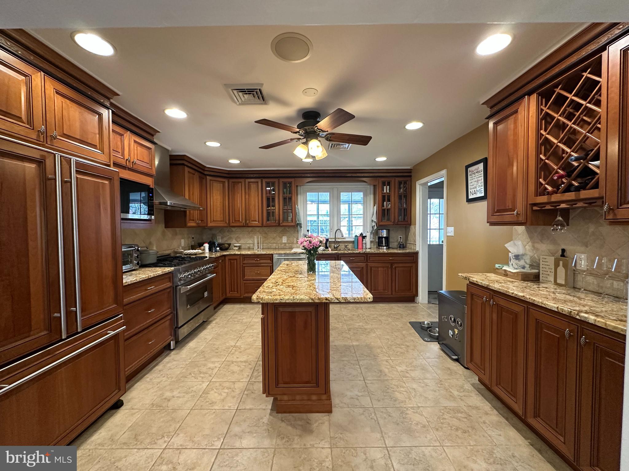 55 Paschall Road Wilmington, DE 19803 - Photo 5 of 18 a large kitchen with stainless steel appliances granite countertop a stove refrigerator and a sink