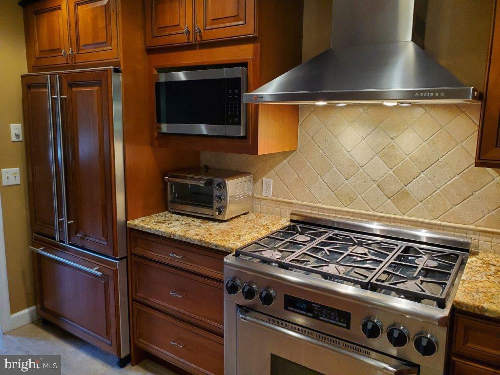 55 Paschall Road Wilmington, DE 19803 - Photo 7 of 18 a stove top oven sitting inside of a kitchen
