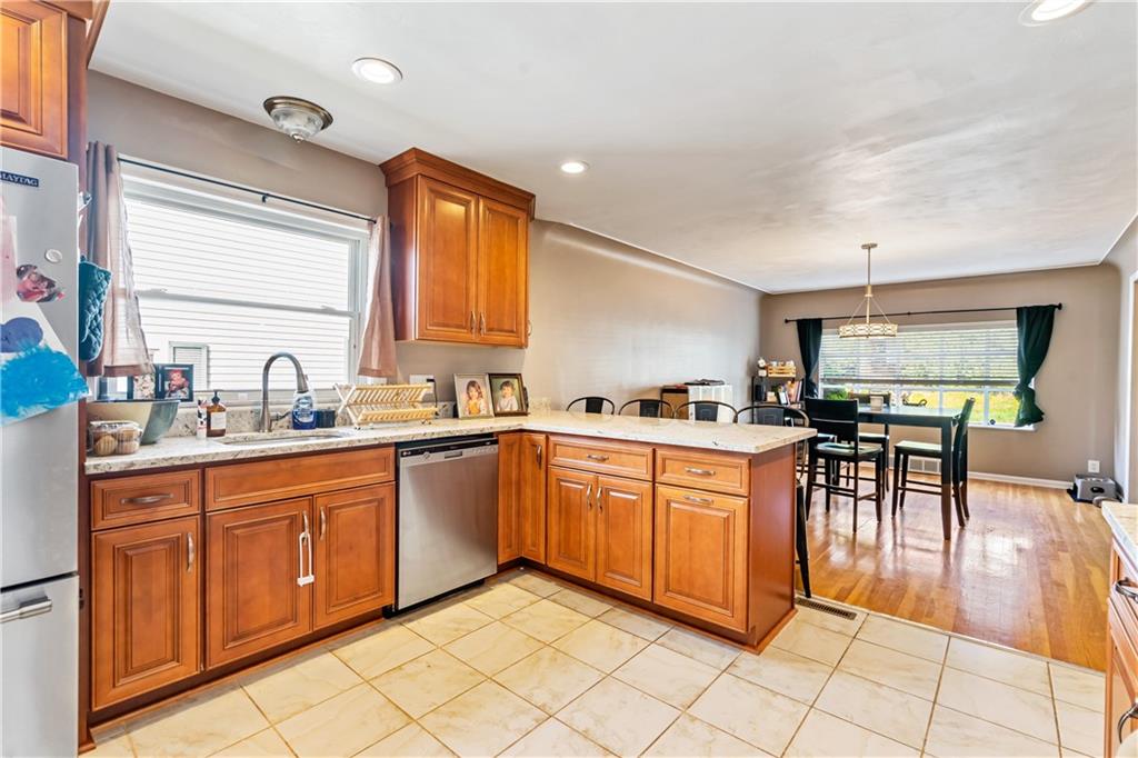 414 Hancock Avenue Vandergrift, PA 15690 - Photo 16 of 25 a kitchen with stainless steel appliances granite countertop a sink and a refrigerator
