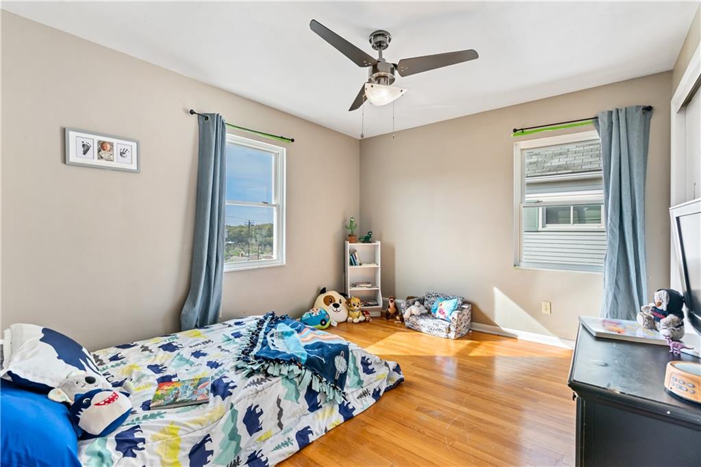 414 Hancock Avenue Vandergrift, PA 15690 - Photo 2 of 25 a bedroom with a bed and a dresser