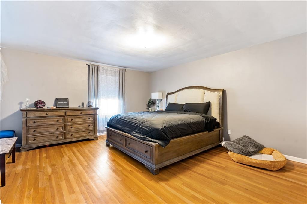 414 Hancock Avenue Vandergrift, PA 15690 - Photo 5 of 25 a bedroom with a bed and dresser