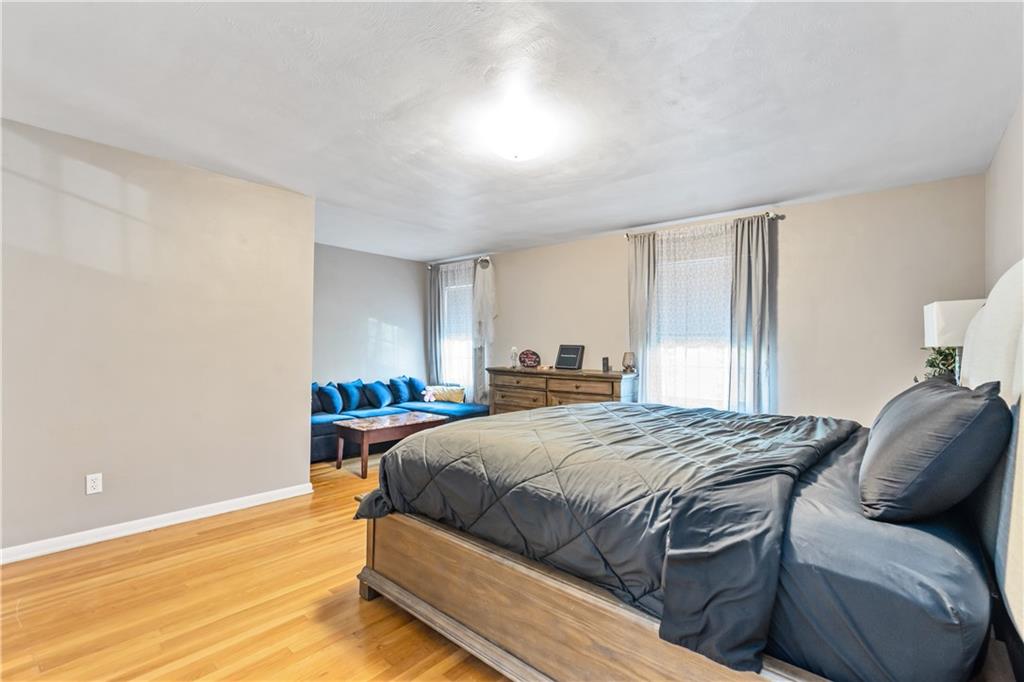 414 Hancock Avenue Vandergrift, PA 15690 - Photo 6 of 25 a bedroom with a bed and a window