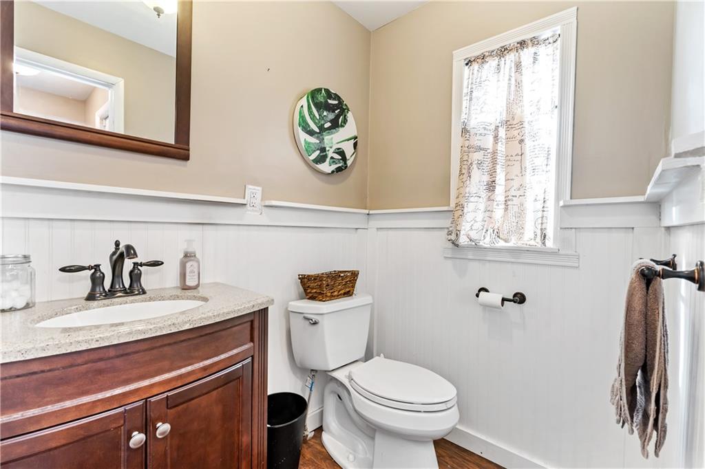 414 Hancock Avenue Vandergrift, PA 15690 - Photo 7 of 25 a bathroom with a sink a toilet and a window