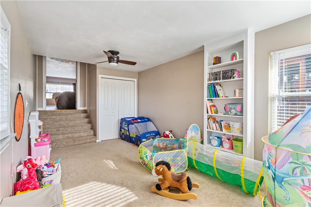 414 Hancock Avenue Vandergrift, PA 15690 - Photo 8 of 25 a living room with furniture and a book shelf