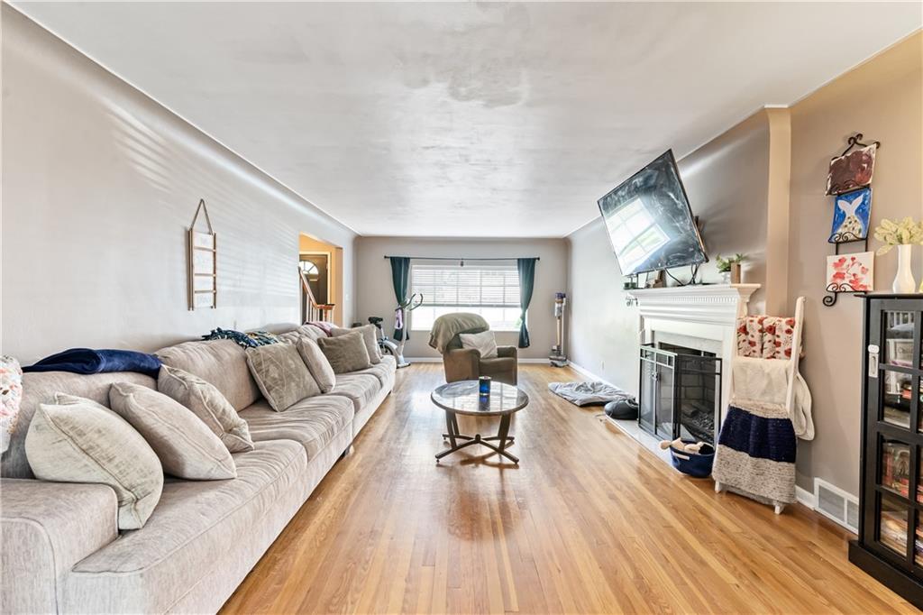 414 Hancock Avenue Vandergrift, PA 15690 - Photo 9 of 25 a living room with furniture and a fireplace