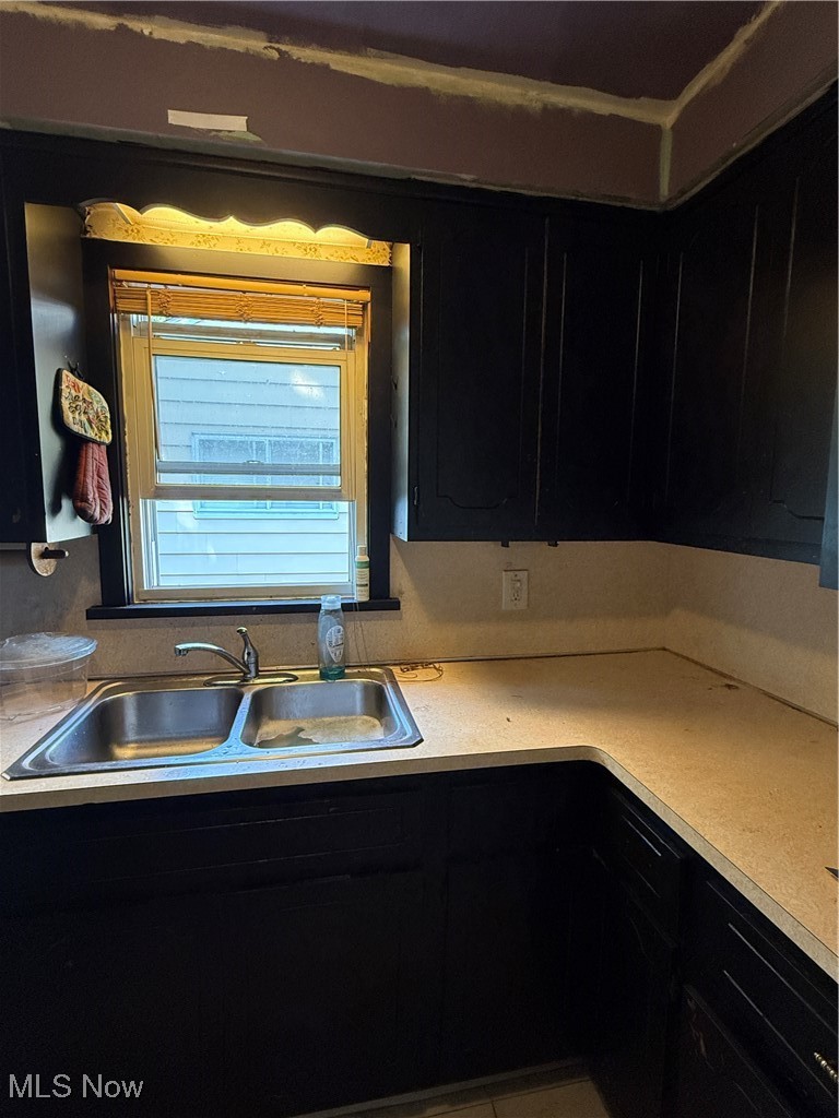 20682 Centuryway Road Maple Heights, OH 44137 - Photo 12 of 16 Kitchen with dark cabinets and light countertops