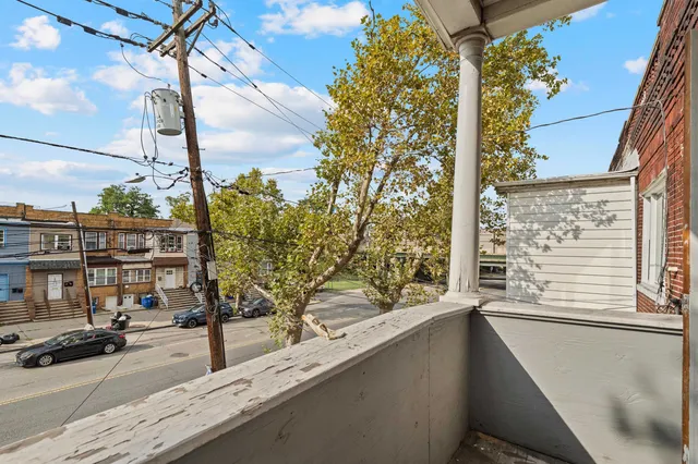 a view of a street from a balcony