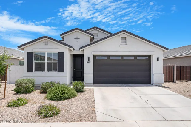 a front view of a house with garage