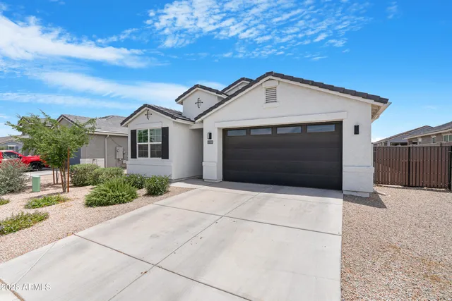 a front view of a house with garage
