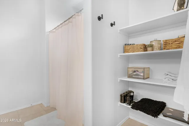 a white wall with a sink