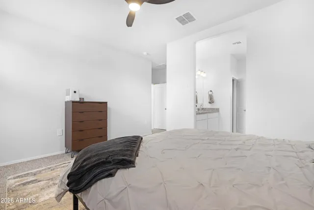 a bedroom with a bed and a cabinets