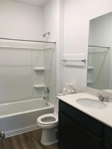a bathroom with a sink a toilet and a bathtub