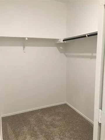a view of an empty walk in closet