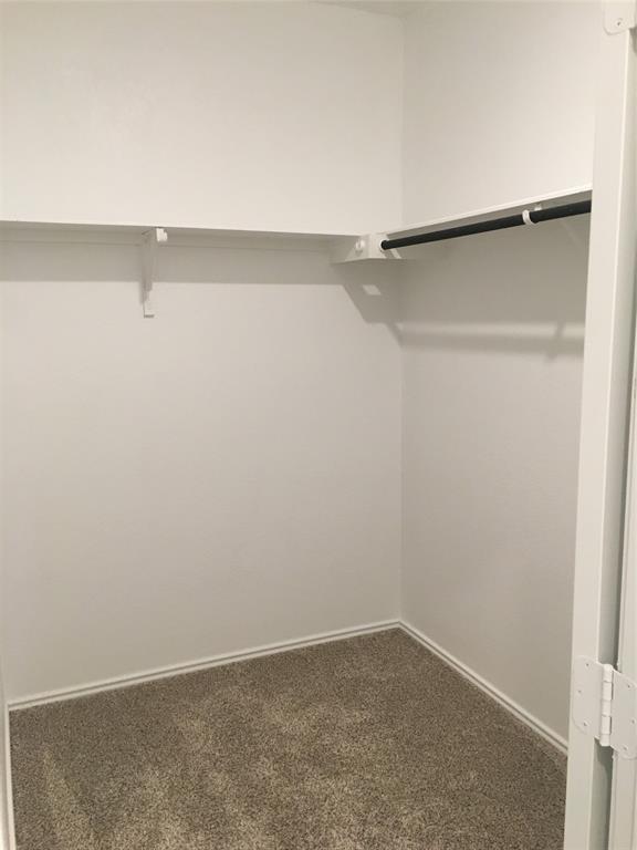 558 Gabbro Gardens Maxwell, TX 78656 - Photo 15 of 29 a view of an empty walk in closet