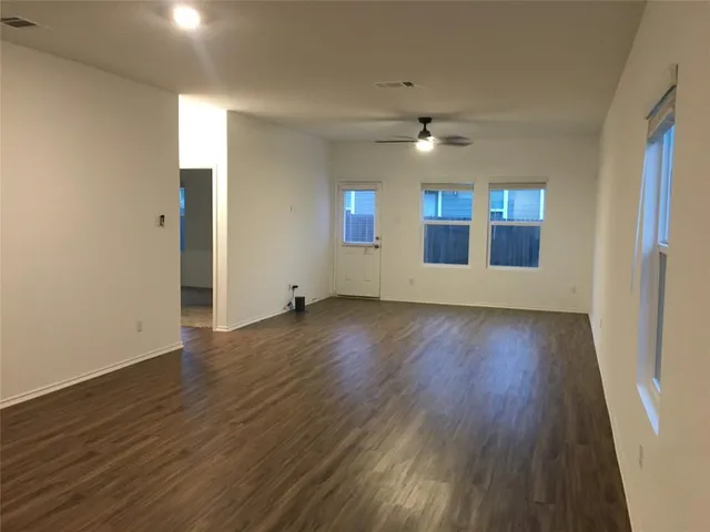 a kitchen with a sink and mirror