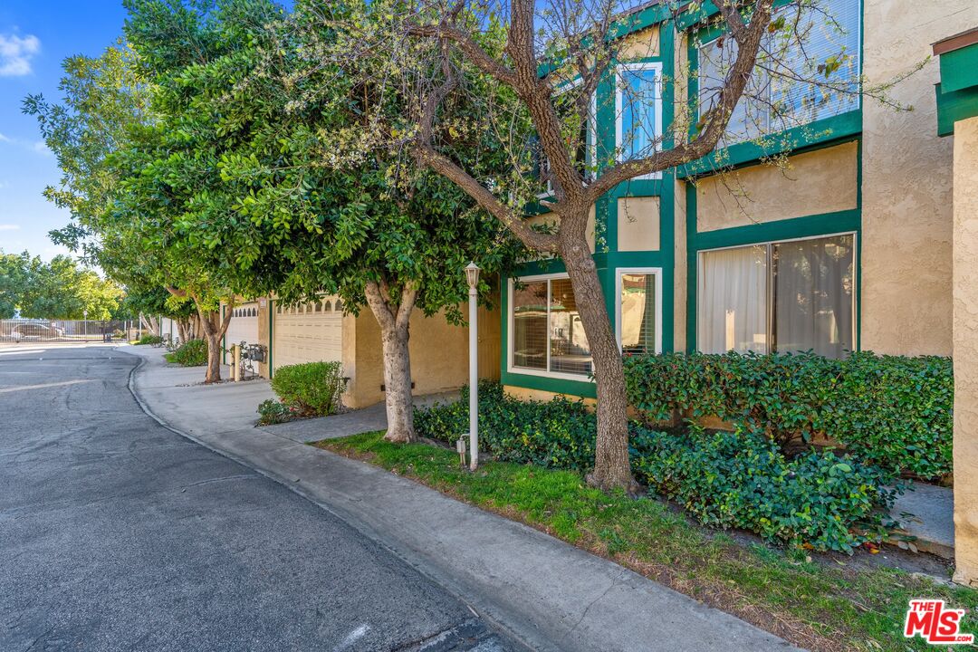 17221 Roscoe Boulevard, Unit 11 Northridge, CA 91325 - Photo 2 of 38 a view of a building with a tree