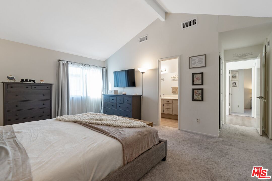 17221 Roscoe Boulevard, Unit 11 Northridge, CA 91325 - Photo 21 of 38 a bedroom with a large bed and dresser