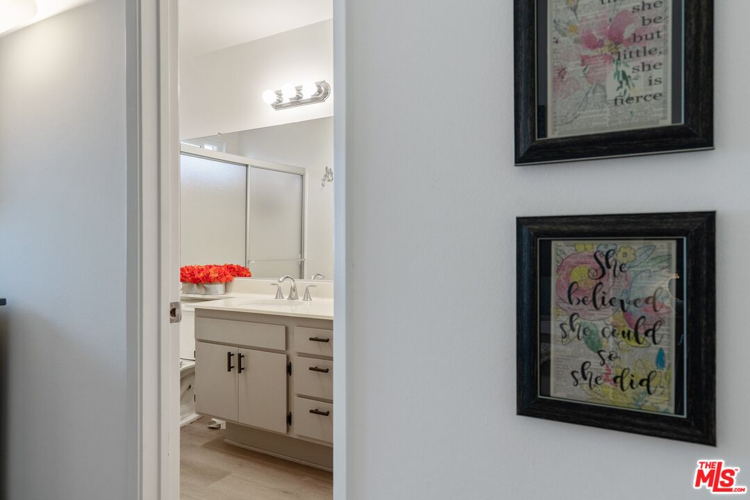 17221 Roscoe Boulevard, Unit 11 Northridge, CA 91325 - Photo 23 of 38 a room with painting on the wall and a painting on the wall