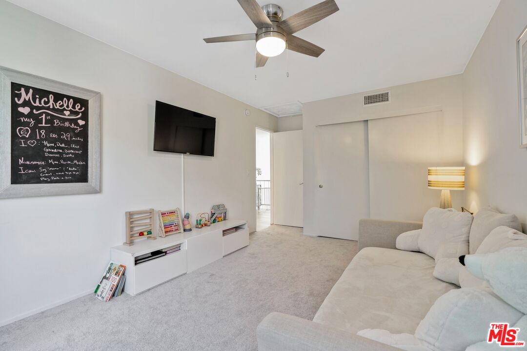 17221 Roscoe Boulevard, Unit 11 Northridge, CA 91325 - Photo 28 of 38 a living room with furniture and a flat screen tv