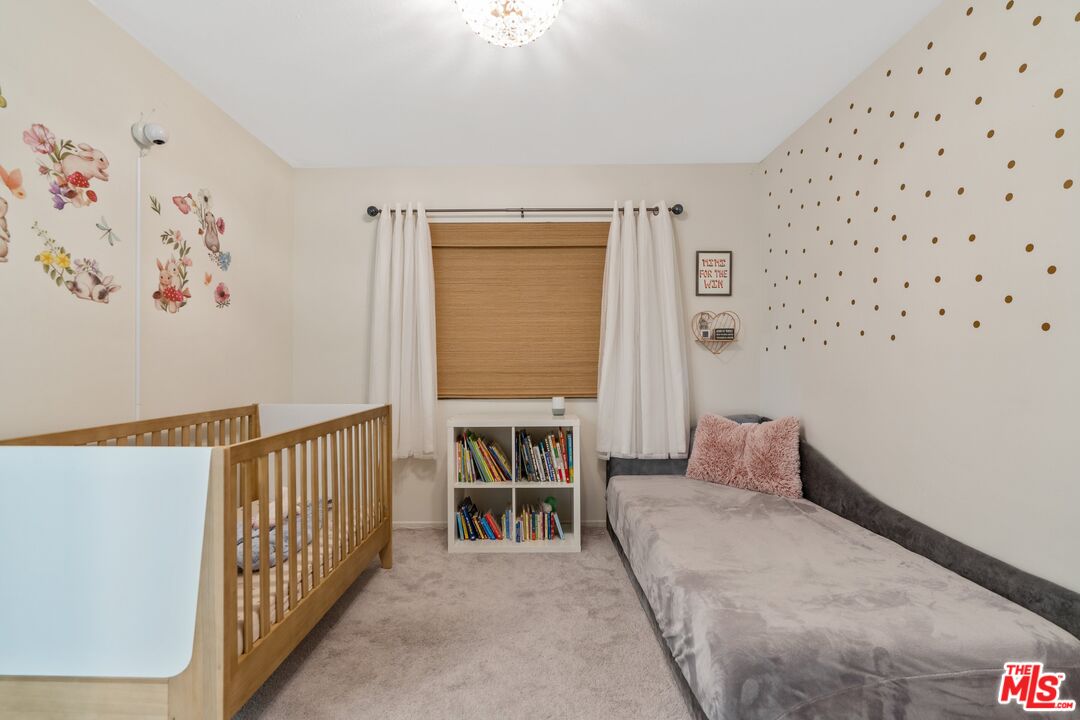 17221 Roscoe Boulevard, Unit 11 Northridge, CA 91325 - Photo 31 of 38 a bedroom with furniture and a window