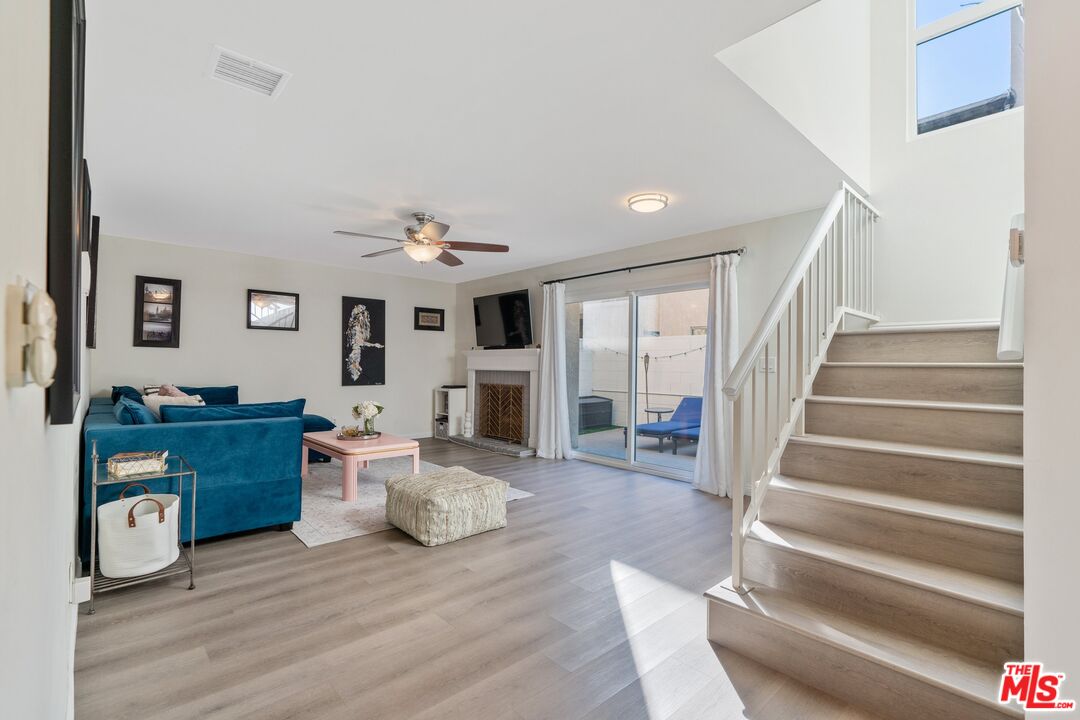 17221 Roscoe Boulevard, Unit 11 Northridge, CA 91325 - Photo 4 of 38 a living room with furniture and a wooden floor