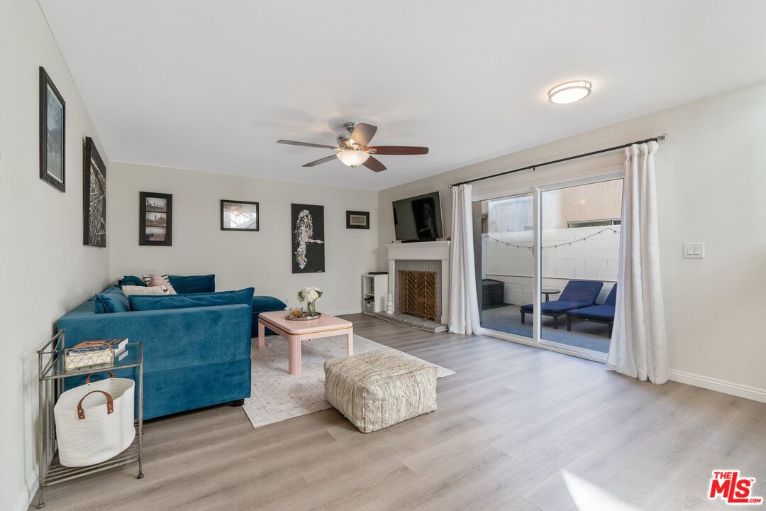 17221 Roscoe Boulevard, Unit 11 Northridge, CA 91325 - Photo 5 of 38 a living room with furniture and a fireplace
