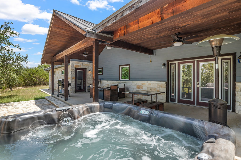 13326 Trautwein Road Austin, TX 78737 - Photo 36 of 38 View of patio / terrace featuring a ceiling fan and a hot tub