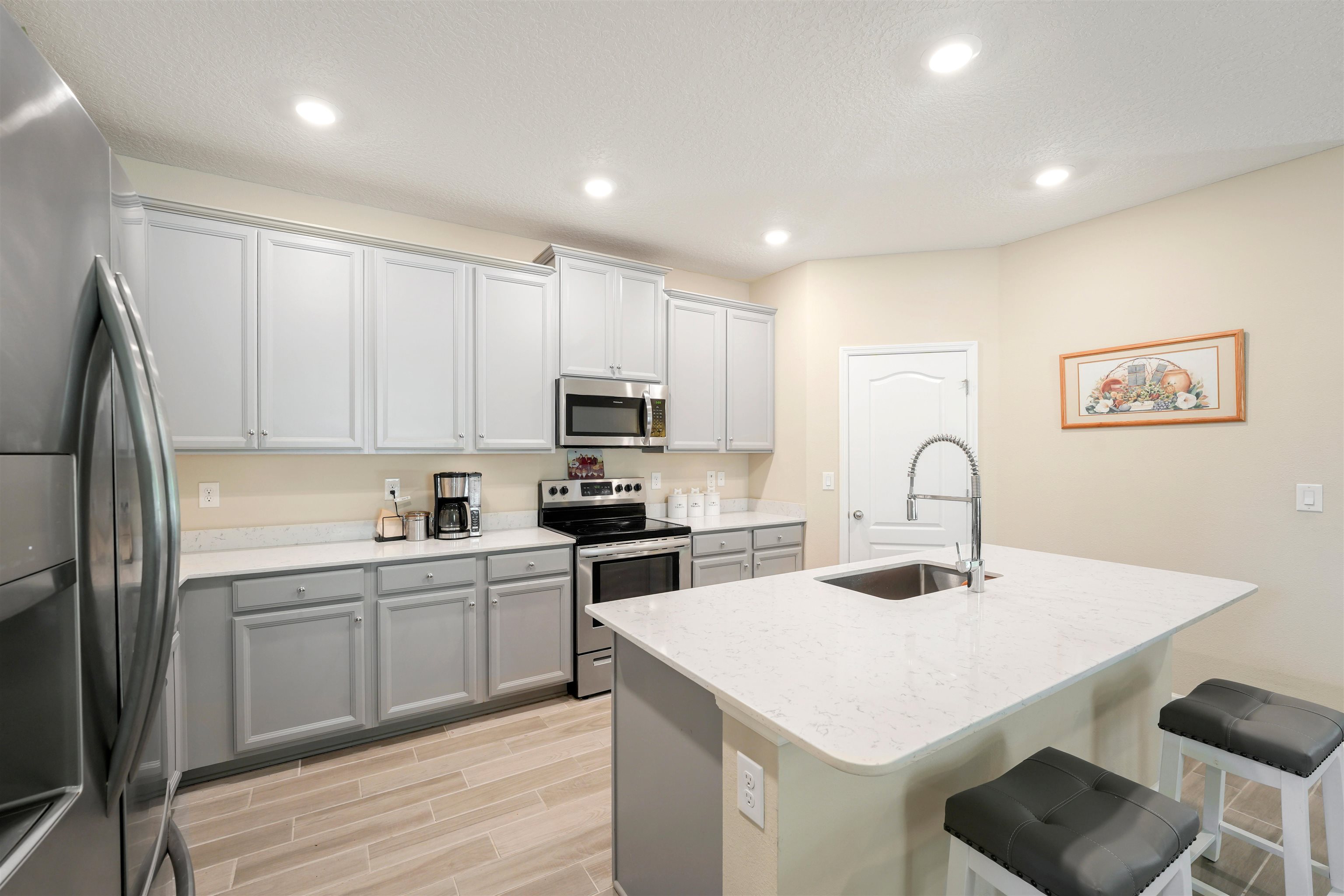 503 Stone Arbor Lane St. Augustine, FL 32086 - Photo 12 of 44 a kitchen with a sink a stove and cabinets
