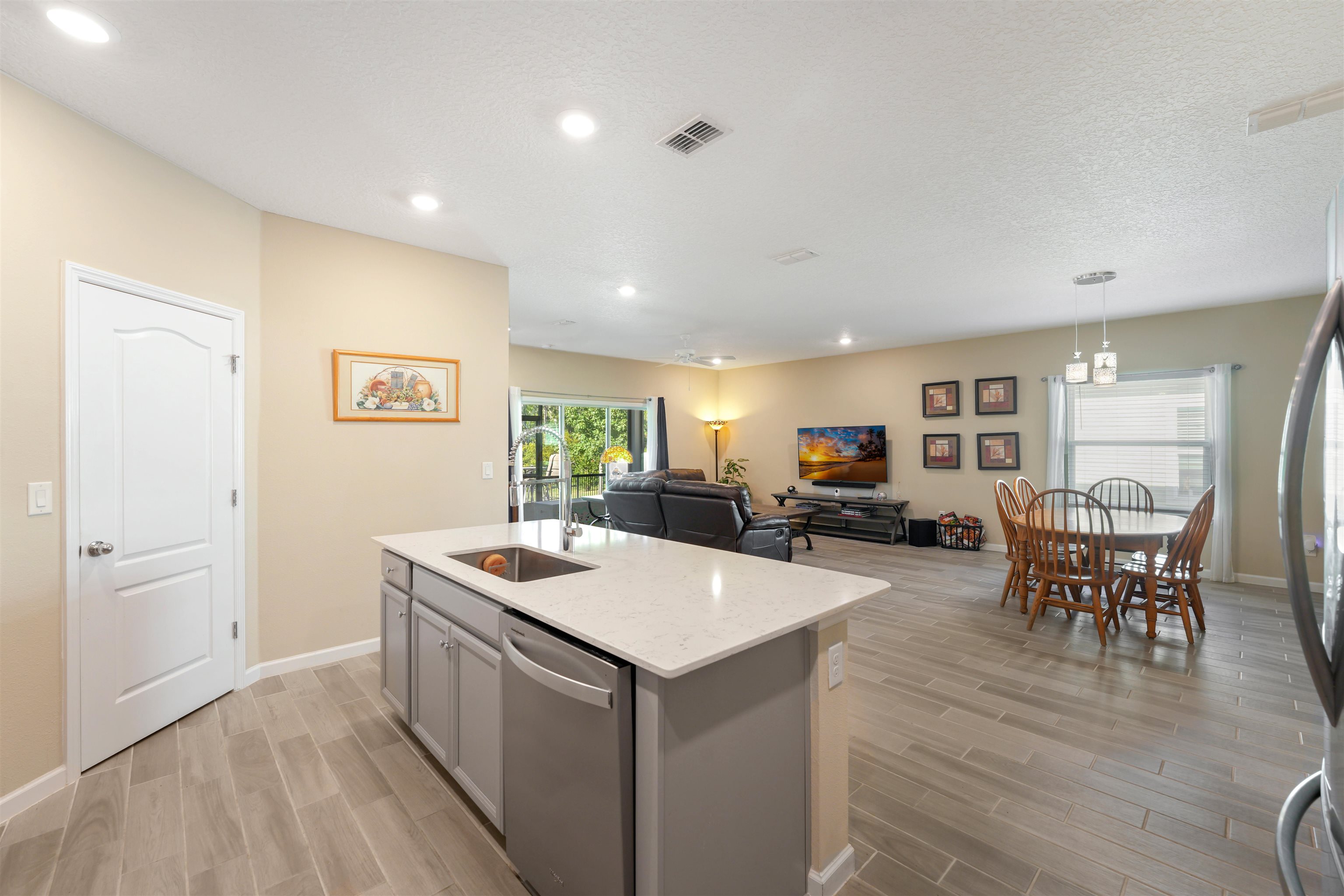 503 Stone Arbor Lane St. Augustine, FL 32086 - Photo 44 of 44 a kitchen with a sink and chairs