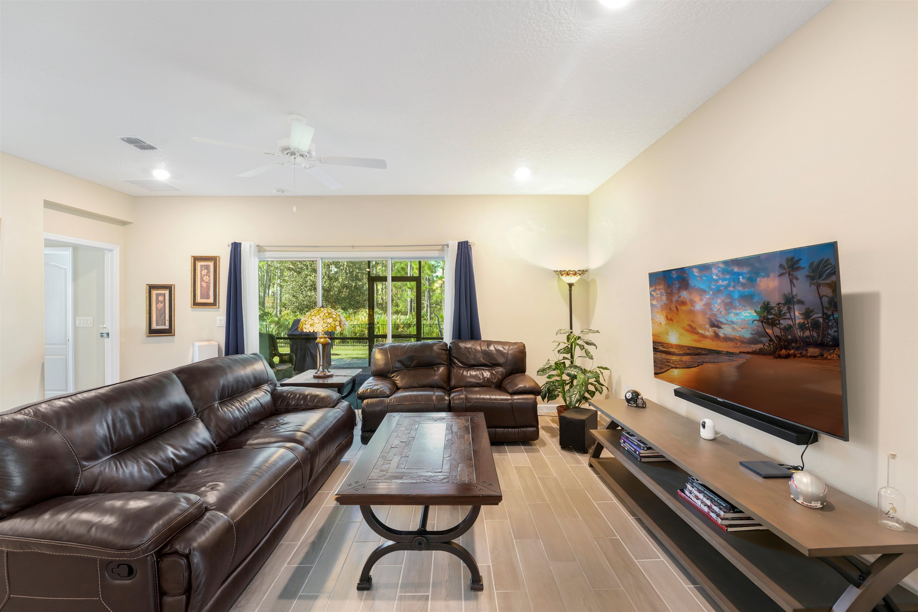 503 Stone Arbor Lane St. Augustine, FL 32086 - Photo 17 of 44 a living room with furniture and a flat screen tv
